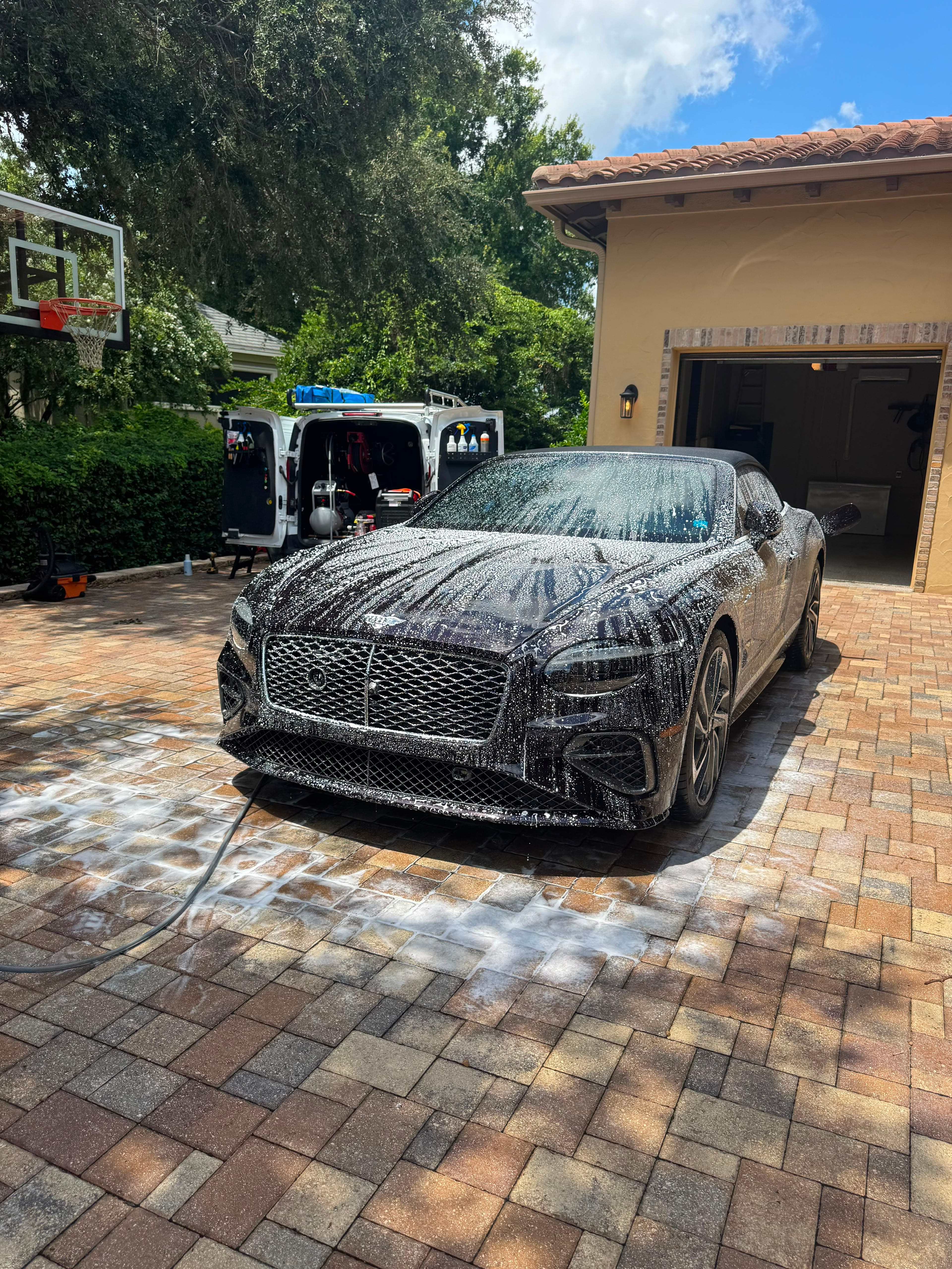 Freshly detailed Bentley in a Tampa Bay driveway