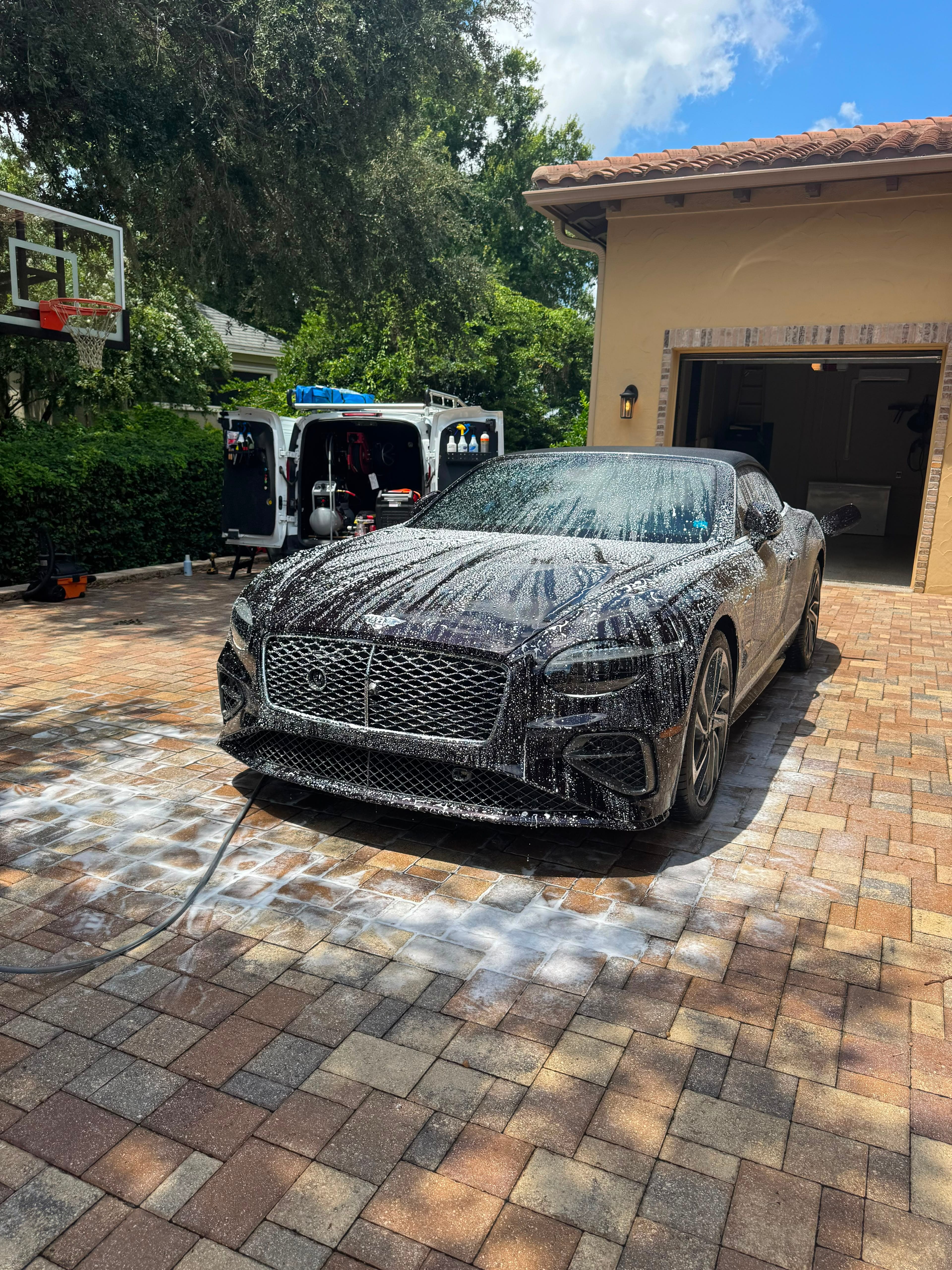Bentley covered in foam during a mobile detail