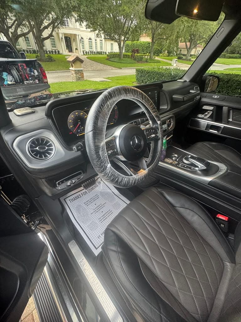 Detailed black leather interior of a Mercedes G-Class